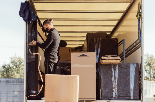 a man packing a moving truck