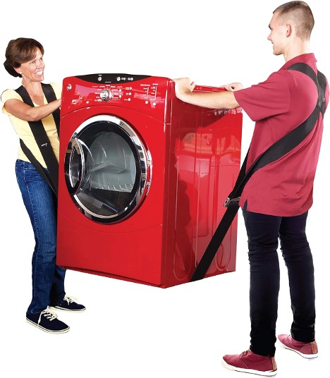 A person and person carrying a washing machine using shoulder moving straps