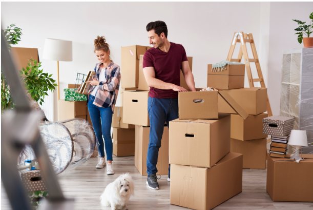 A man and a woman packing up their items