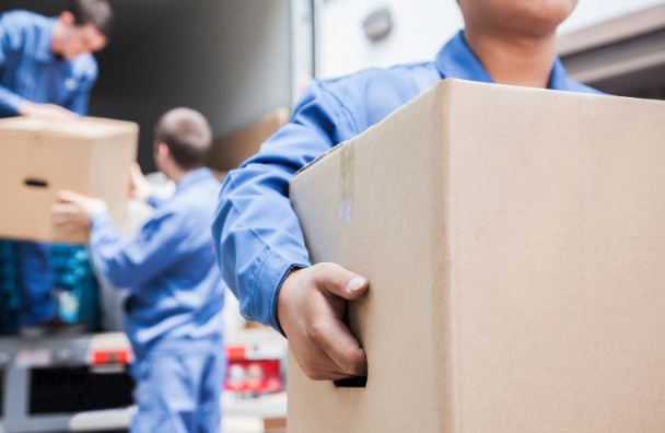 men carrying boxes out of a moving truck