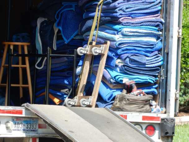 a stack of moving blankets in a moving truck