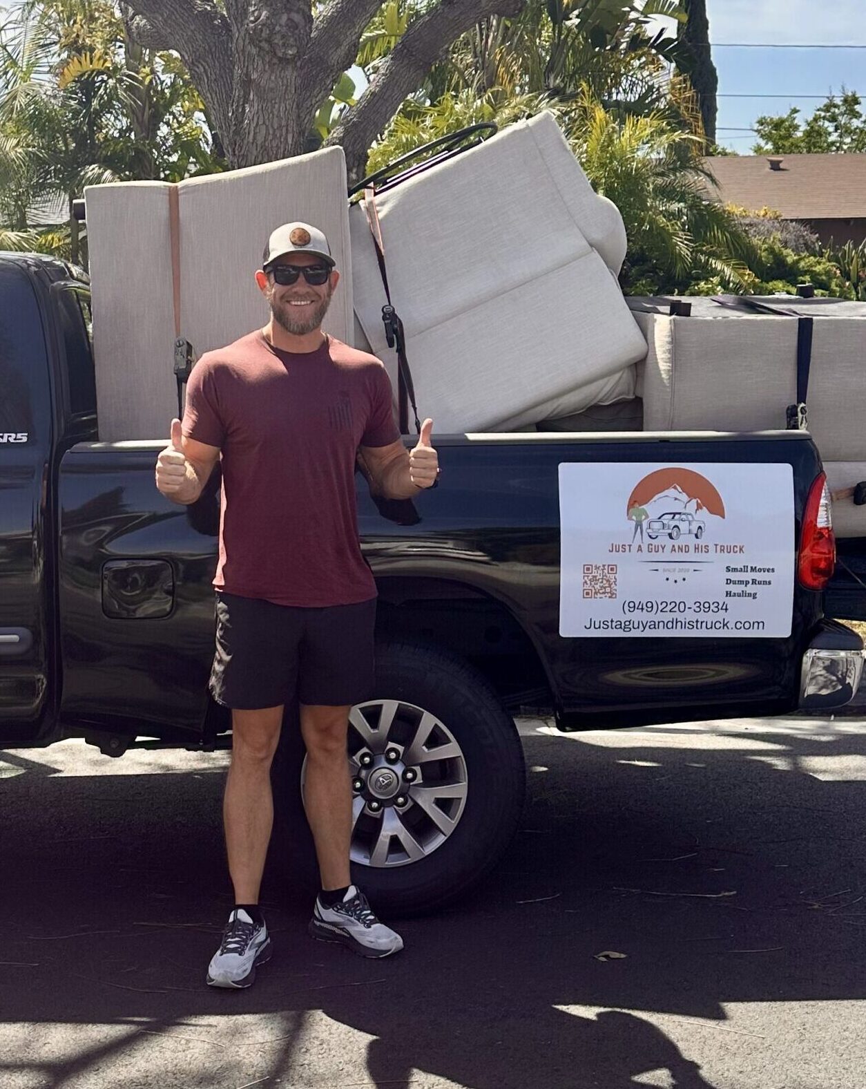 full size couch strapped into pickup truck bed and delivered in Orange County.