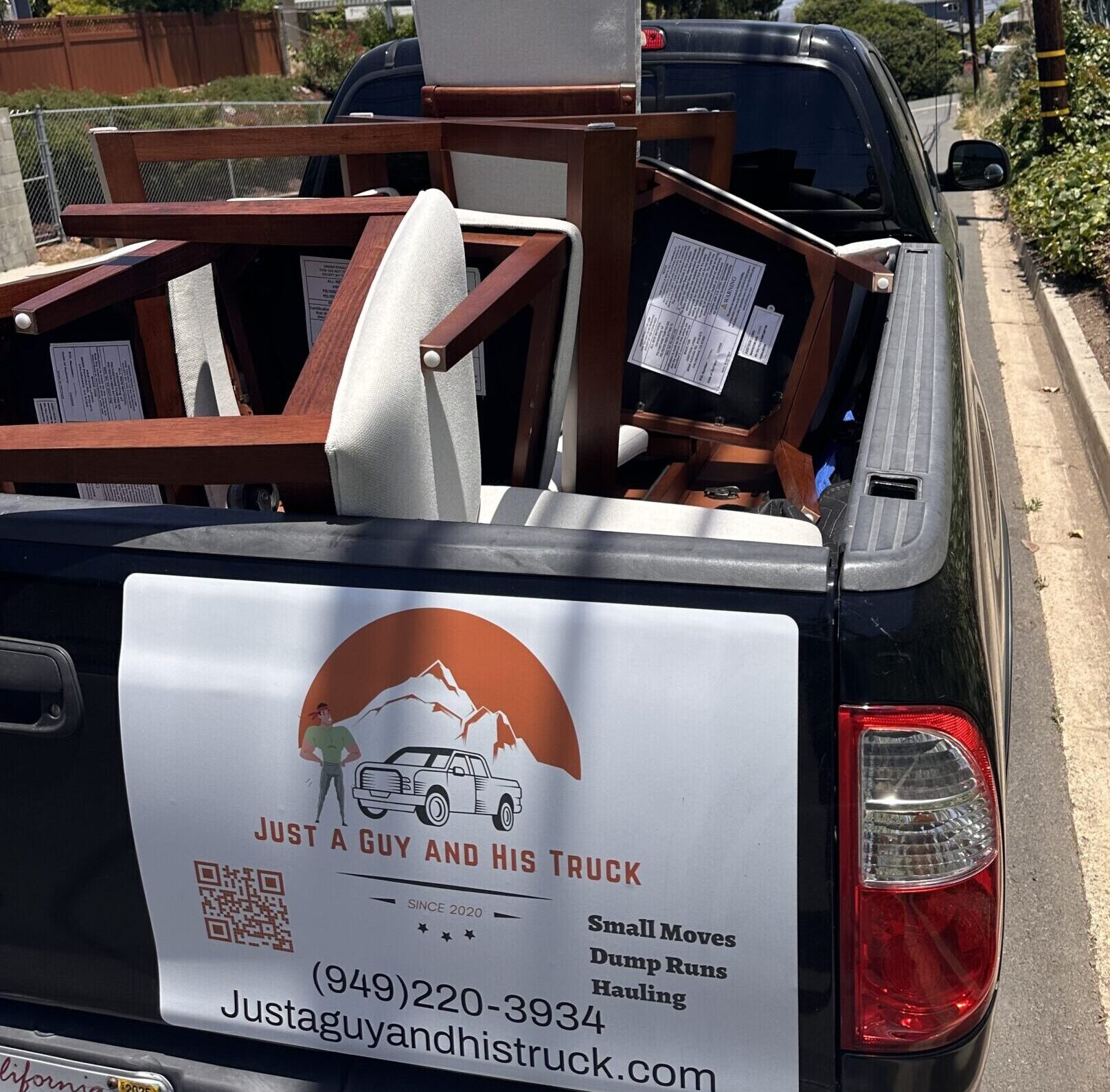 Chairs strapped in a pickup truck bed being delivered to Costa Mesa, CA.