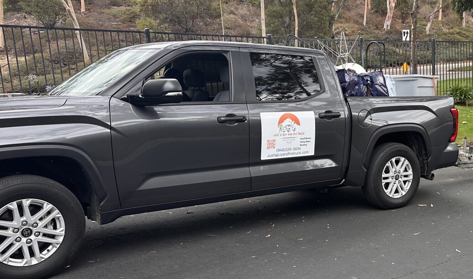 Apartment furniture strapped in a pickup bed for delivery in Huntington Beach.